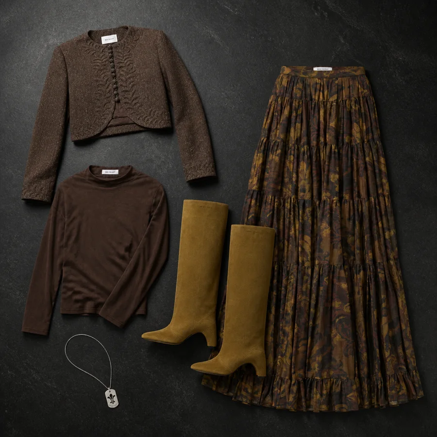 Still life of a brown INTO THE EAST turtleneck, a brown skirt, a brown jacket and brown Coperni boots.