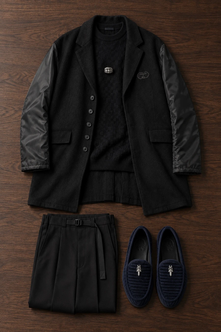 A Christmas party at the hotel bar. Flat lay of a black Undercover jacket, a black Louis Vuitton sweater and black UJOH trousers.
