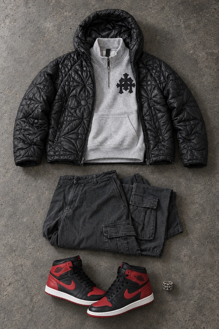 A December night in Seongsu. Flat lay of a black Louis Vuitton jacket, a grey Chrome Hearts quarter zip and black Acne Studios cargo pants.