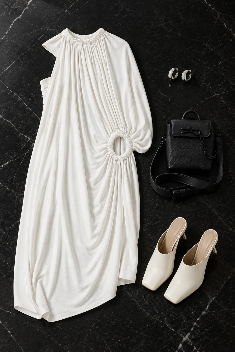 A night at Alserkal. Flat lay of a white Coperni dress, cream MM6 mules, silver Tom Wood hoop earrings and a black Louis Vuitton bag.