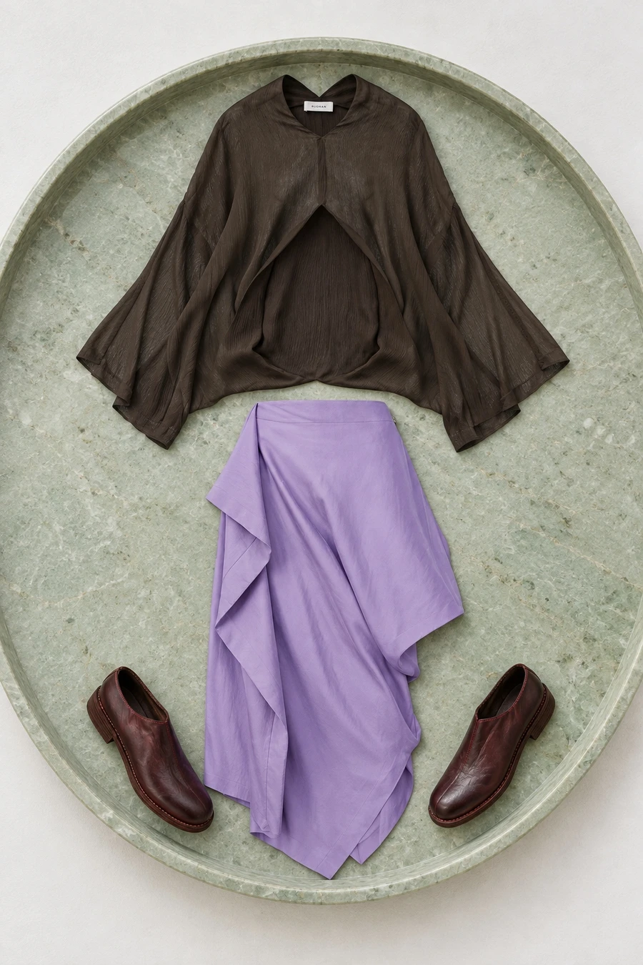 A brown RUOHAN top, purple Issey Miyake skirt and burgundy Guidi shoes.