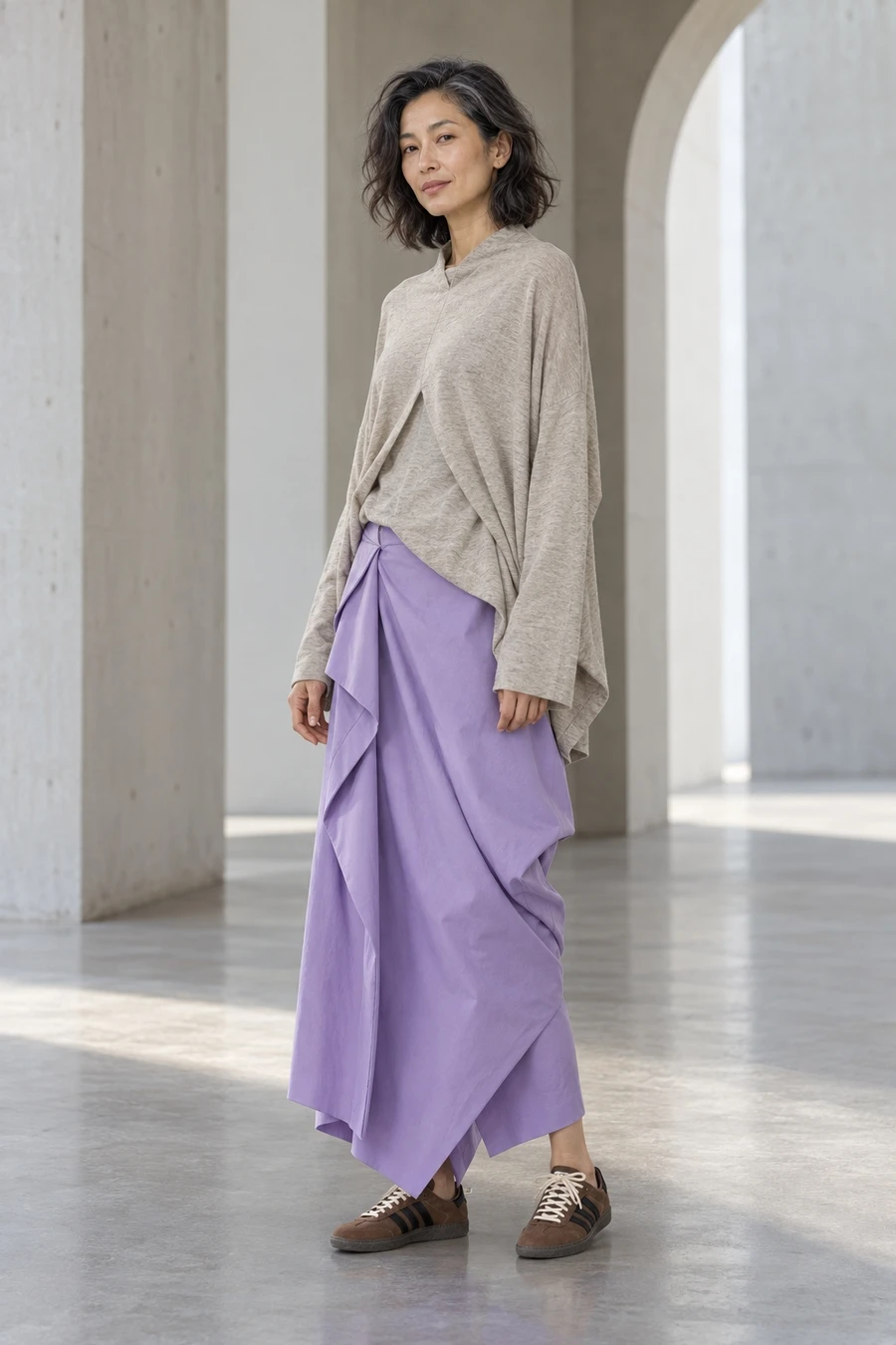 An adult woman wears ecru and purple folds in Tokyo.