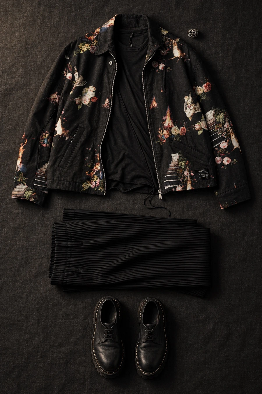 Undercover roses for a gallery night. Flat lay of a pink Undercover blouson, a black Masnada T-shirt and black Issey Miyake trousers.